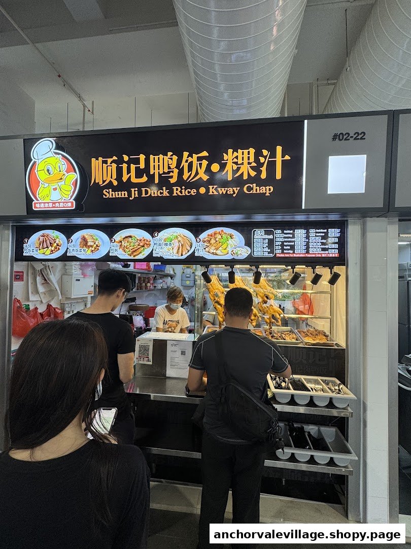 Customers queueing at Shun Ji Duck Rice Kway Chap stall with roasted ducks on display.