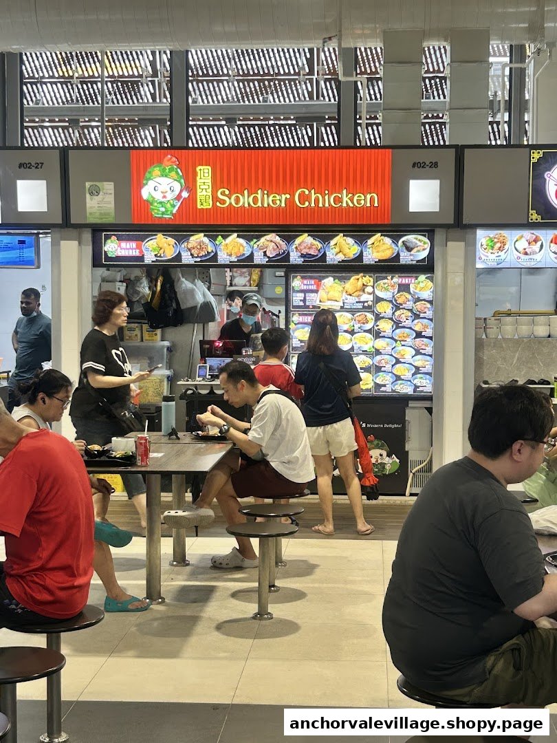 A bustling food stall, Soldier Chicken, serving customers in a vibrant food court setting.