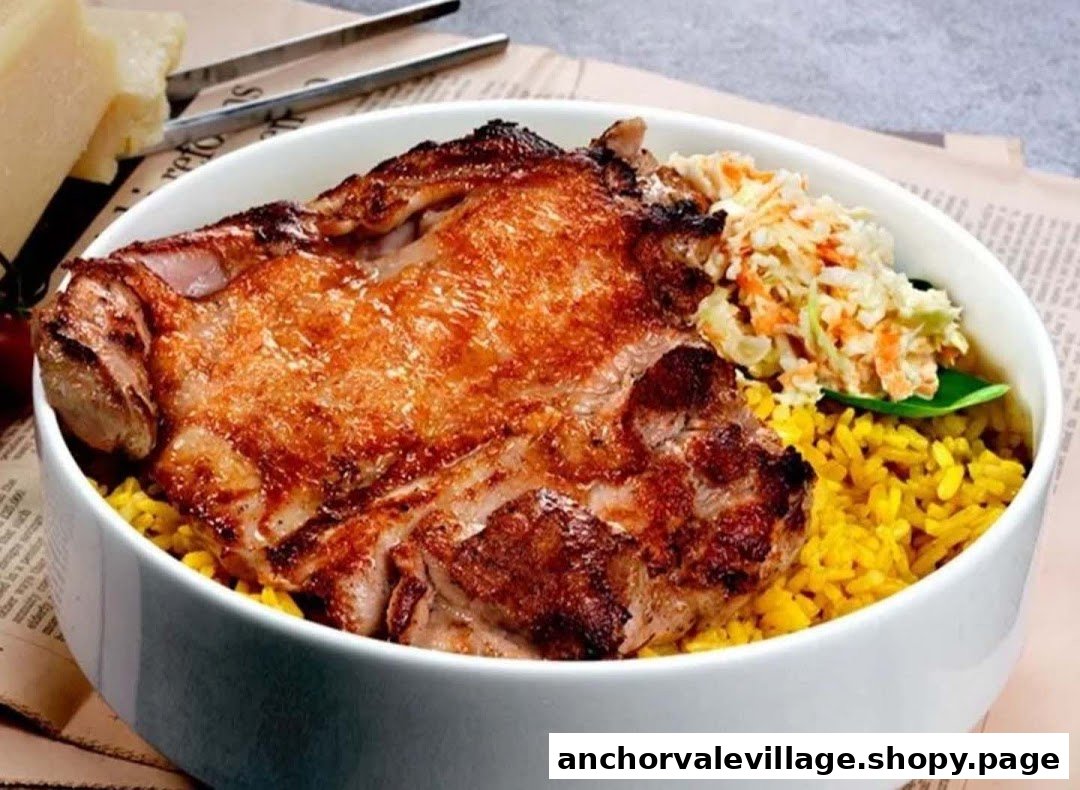 A close-up of a grilled chicken chop served with yellow rice and coleslaw in a white bowl.