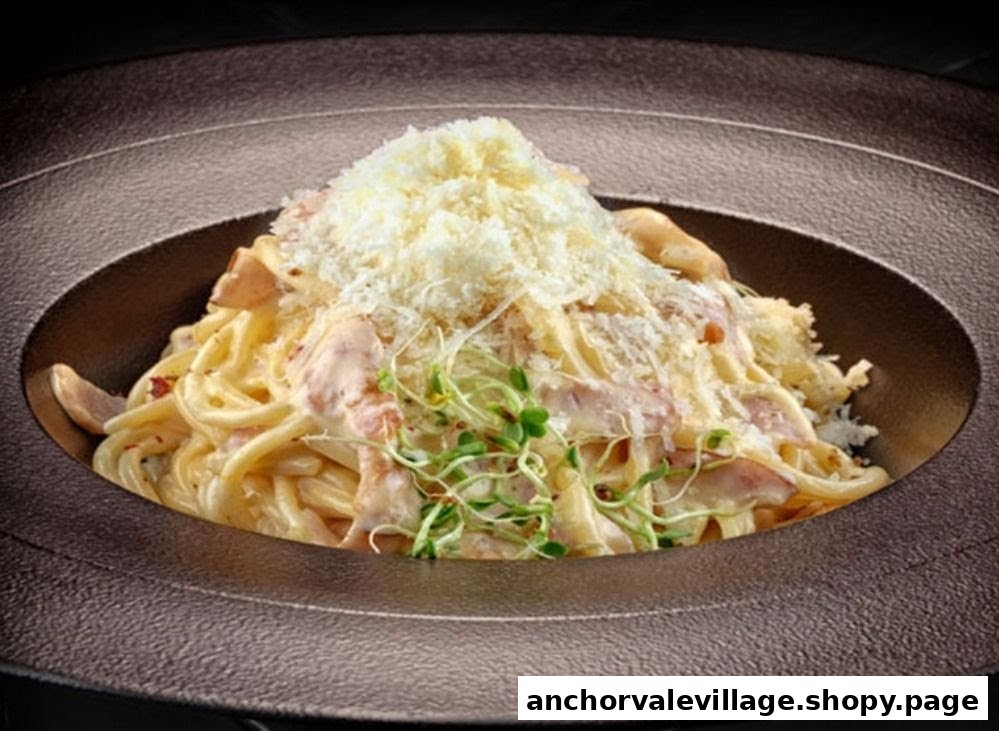 A close-up of creamy pasta topped with grated cheese and fresh sprouts in a dark bowl.