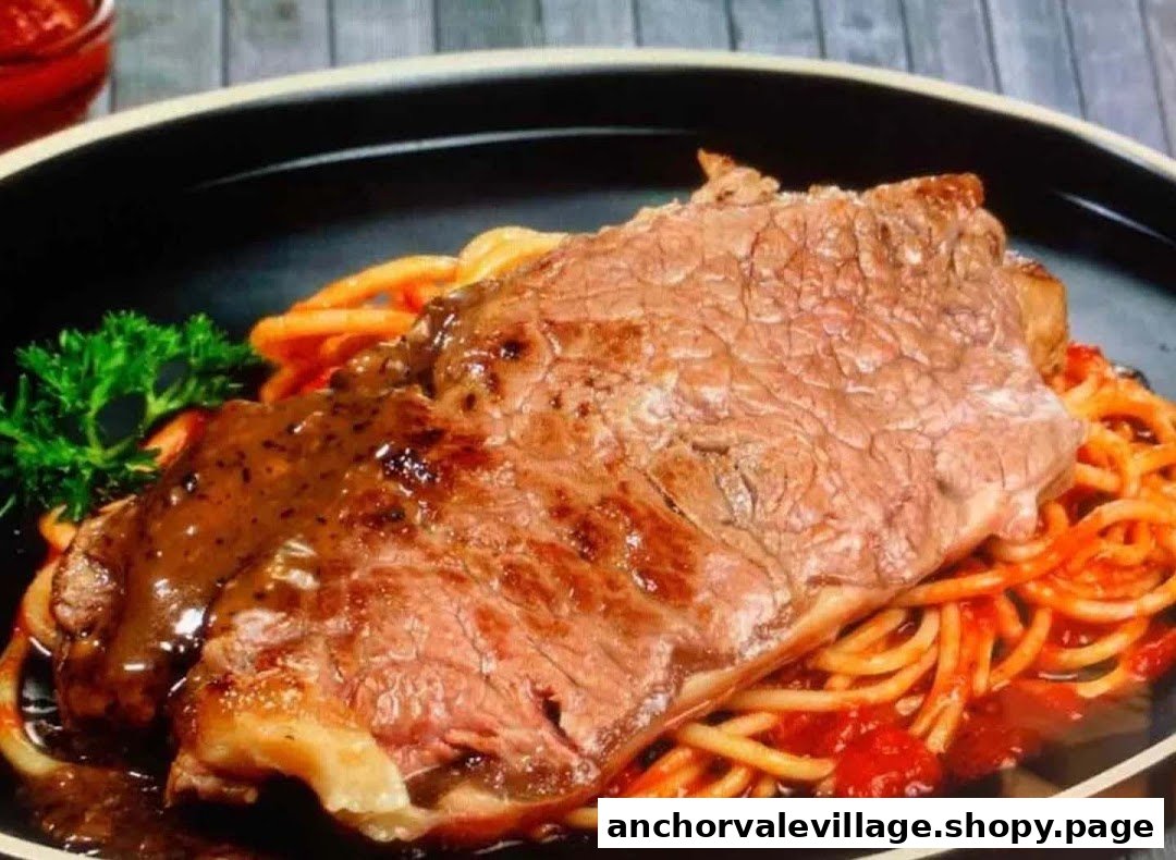A close-up of a grilled steak with gravy served over spaghetti in a black dish.