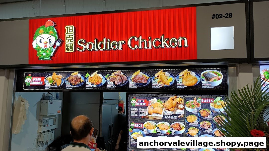 Digital menu boards at Soldier Chicken food stall, displaying various chicken, fish, and meat dishes with prices.