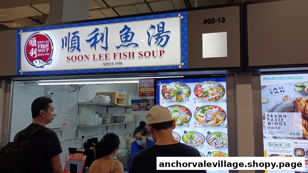 Customers queue at the counter of Soon Lee Fish Soup, featuring its prominent signage and menu displays.