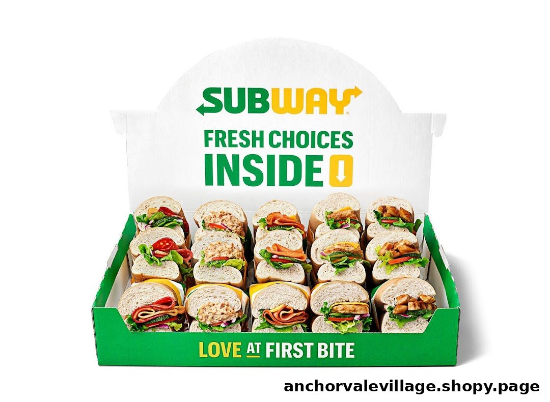 A display box filled with various fresh Subway sandwiches, showcasing catering options.