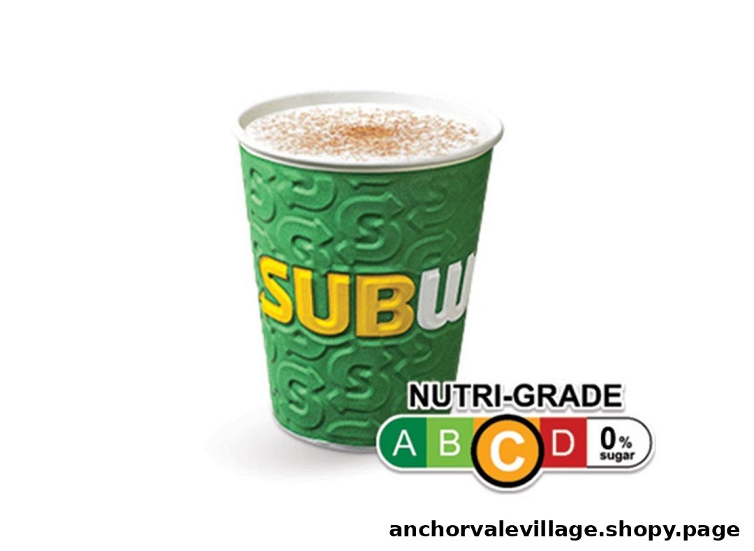 A Subway branded cup containing a drink with foam and cinnamon, featuring a Nutri-Grade C label.