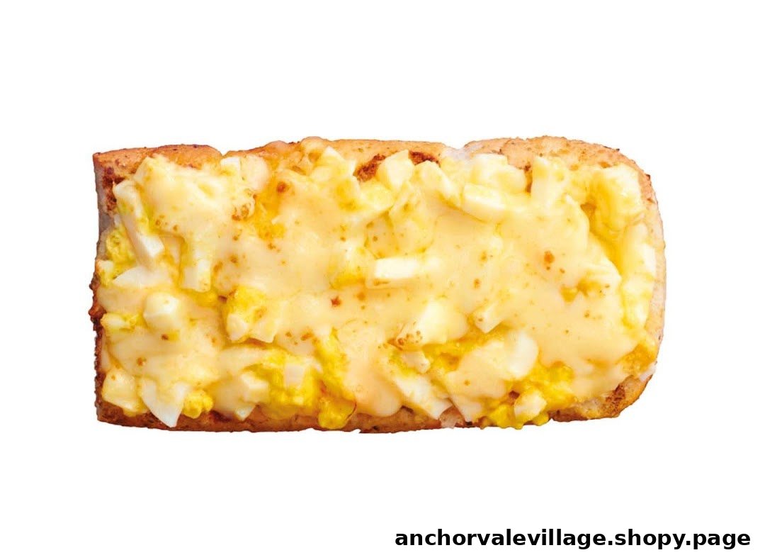 A close-up shot of a Subway sandwich featuring a creamy egg and cheese topping on toasted bread.