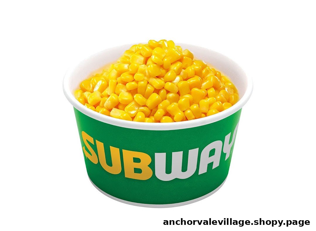 A vibrant green Subway cup filled with golden sweet corn kernels, isolated on a white background.