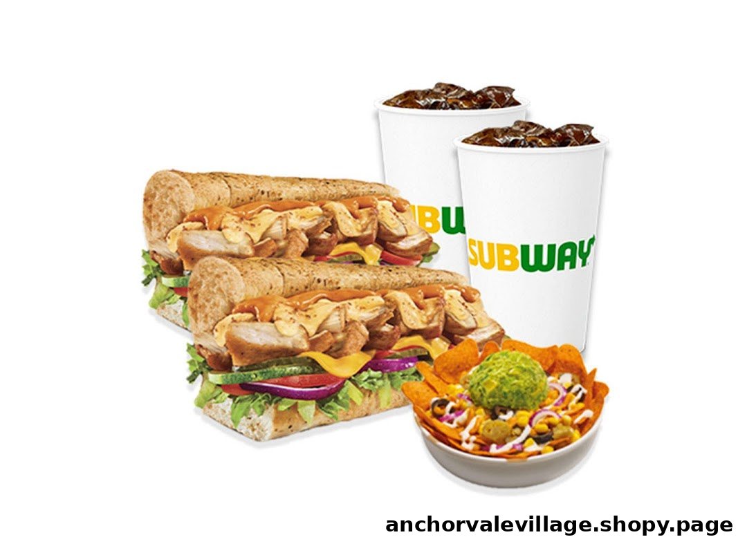 Two Subway subs, two drinks, and a bowl of nachos with guacamole and toppings.