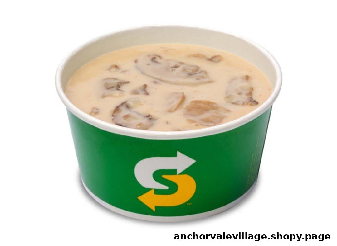 A close-up of a Subway branded cup filled with creamy mushroom soup.