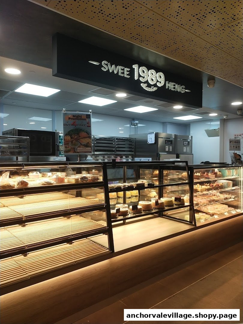 Interior view of Swee Heng 1989 Classic bakery, showcasing display cases filled with pastries and cakes.