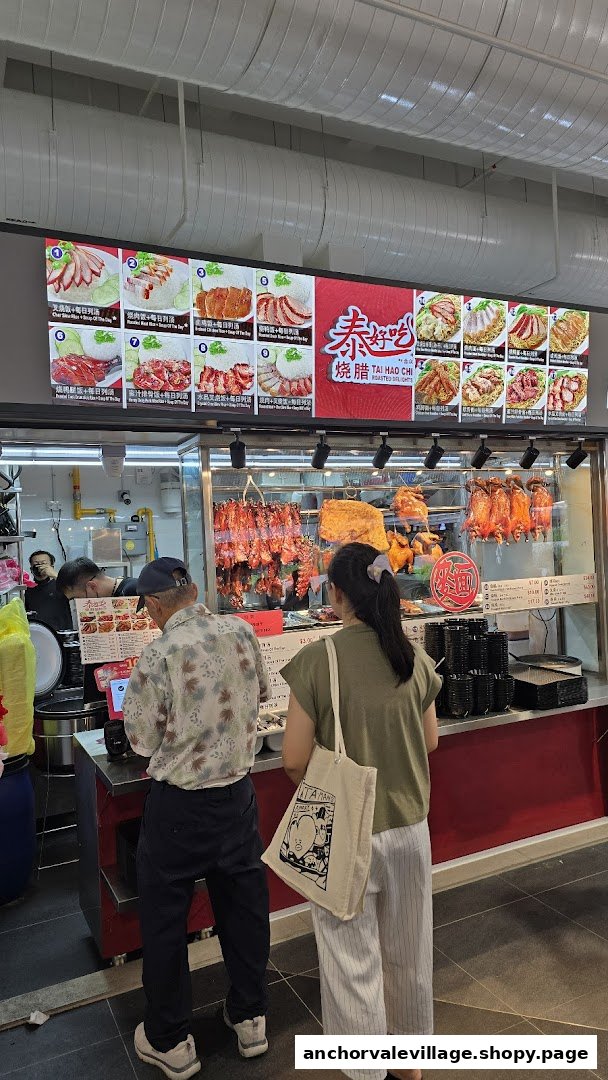 A digital menu board showcasing various roasted meat and noodle dishes with customers ordering.