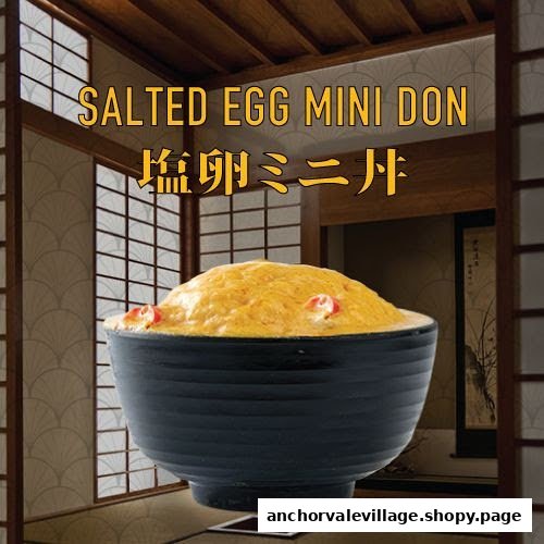 A vibrant image showcasing Takagi Ramen's Salted Egg Mini Don in a black bowl.