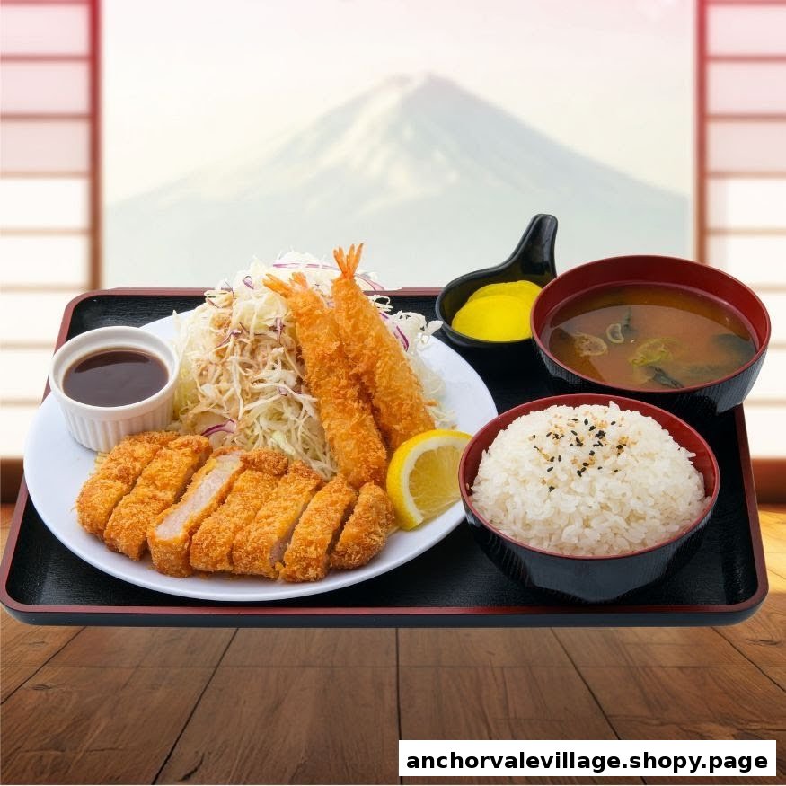 A delicious Japanese set meal featuring crispy tonkatsu, ebi fry, shredded cabbage, rice, and miso soup.