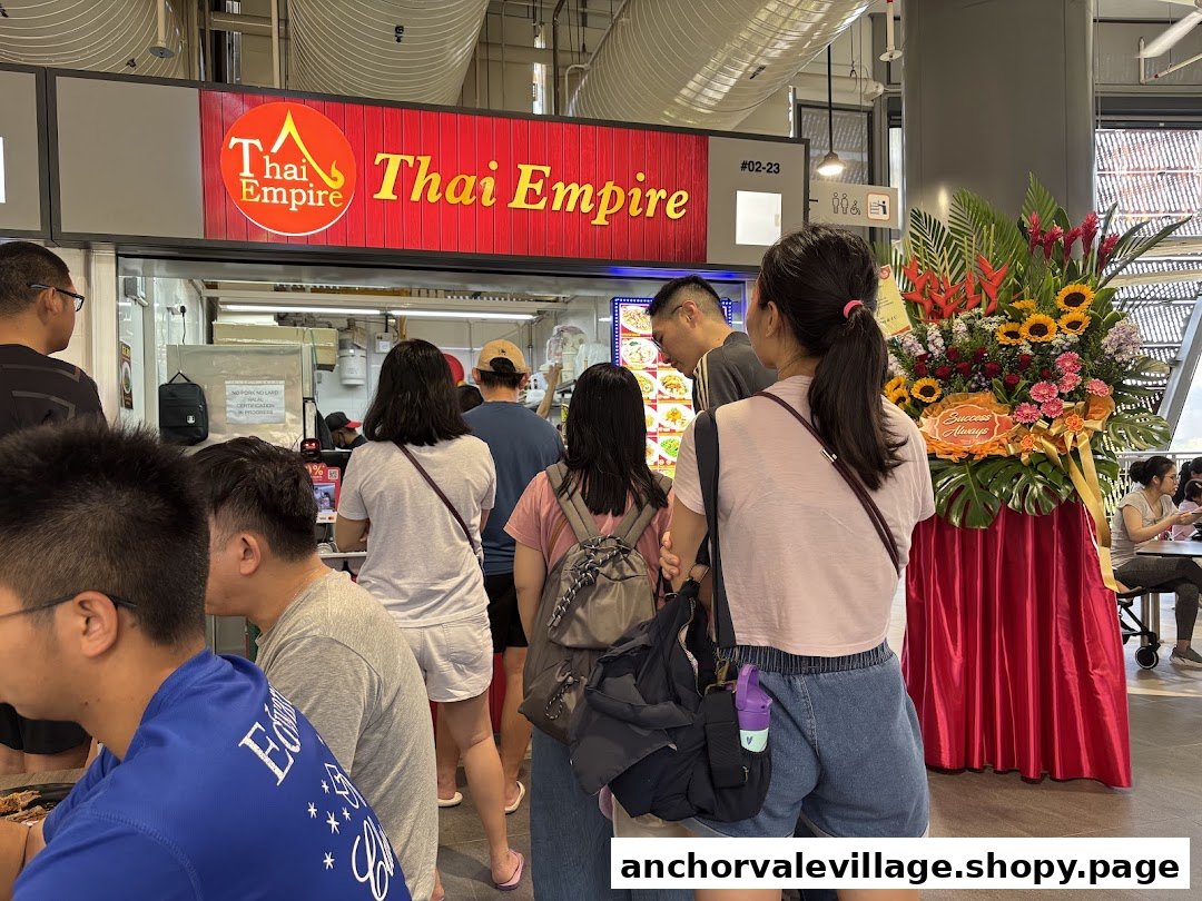 Customers queueing at the entrance of Thai Empire, a bustling food stall.