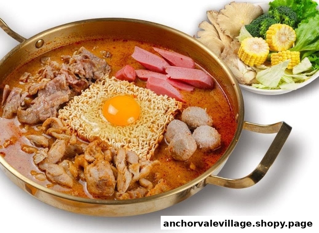 A vibrant hot pot dish featuring noodles, meats, egg, and a side of fresh vegetables.