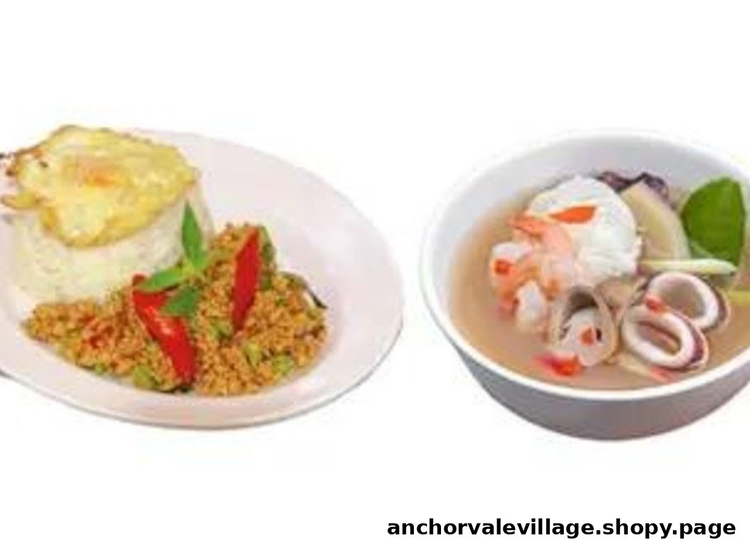 A plate of Thai stir-fry with rice and fried egg, alongside a bowl of seafood soup.