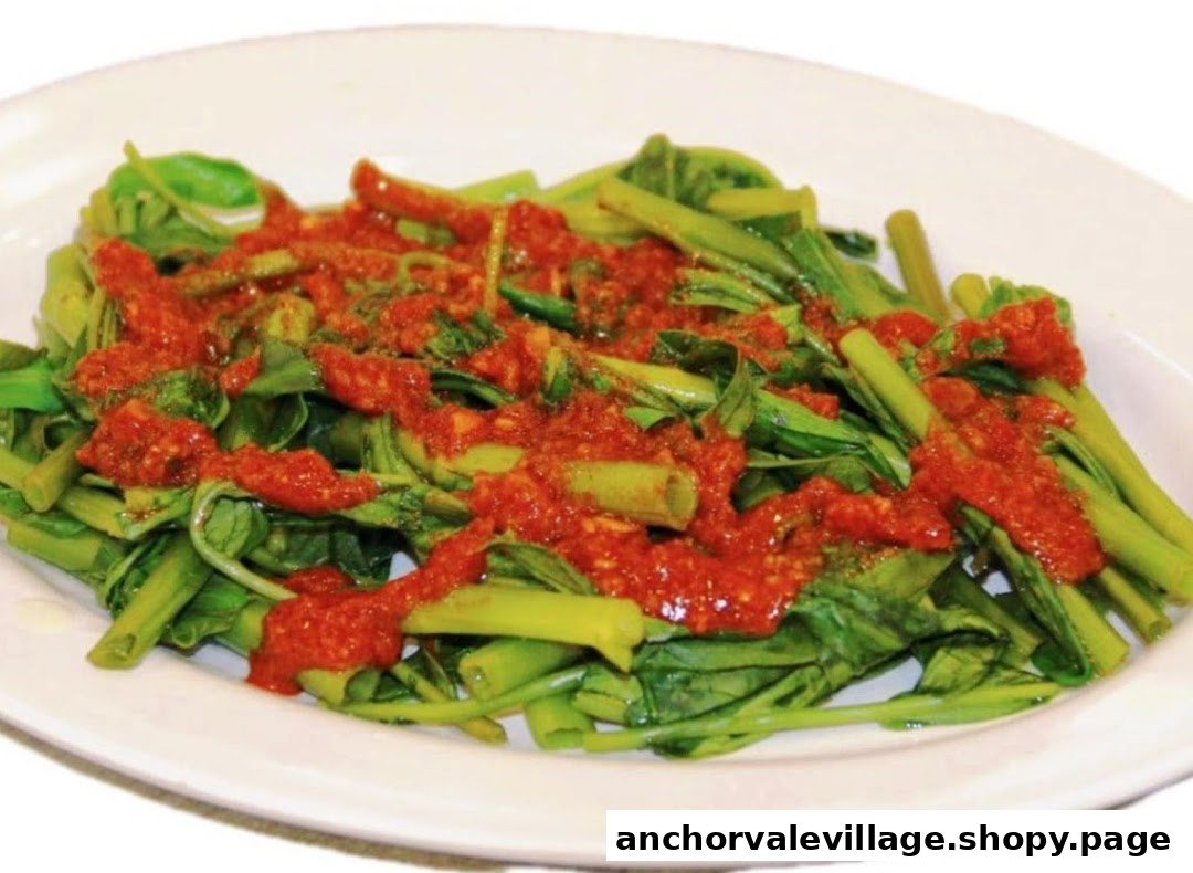 A vibrant plate of stir-fried green vegetables topped with a rich, spicy red sauce.