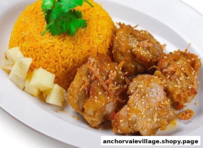 A vibrant plate featuring golden rice, crispy fried meat with sesame seeds, and fresh pineapple chunks.