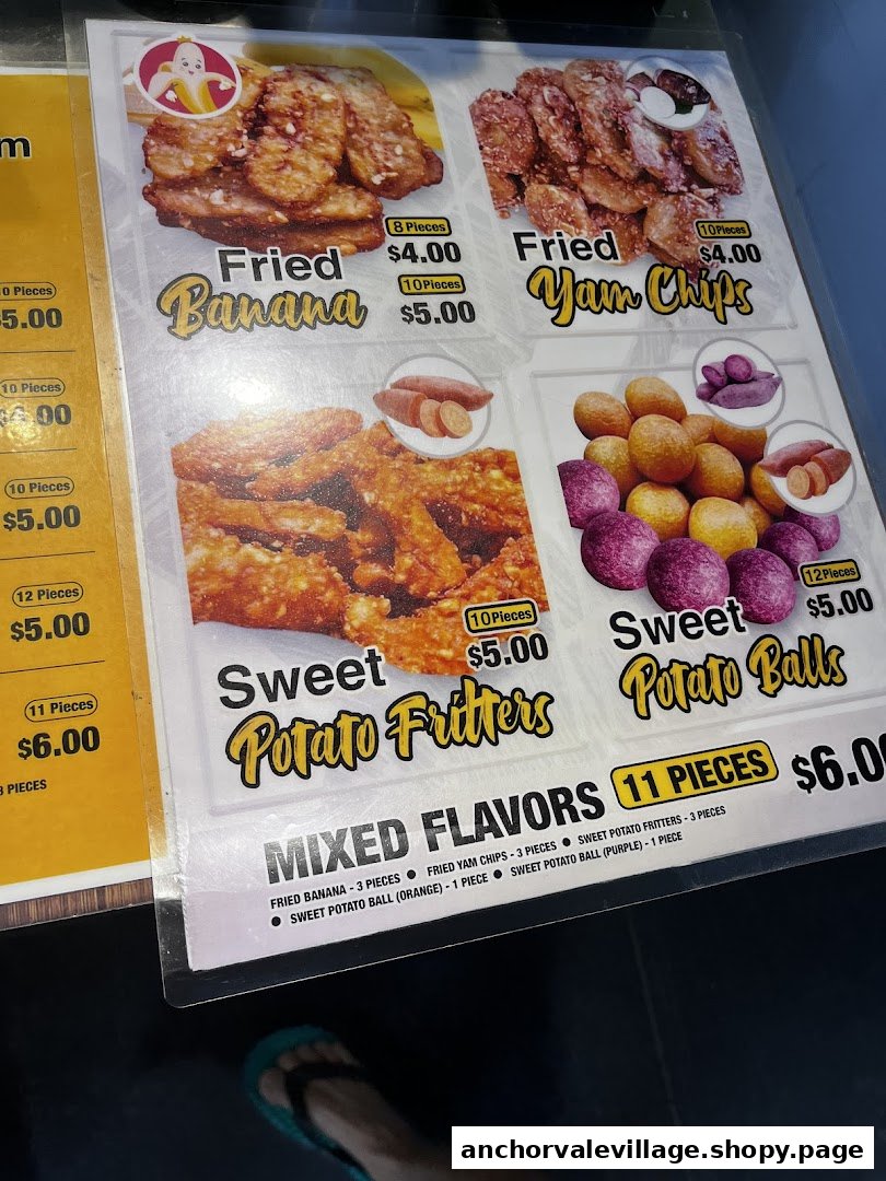 A menu board displaying various fried Thai snacks like bananas, yam chips, and sweet potato items.