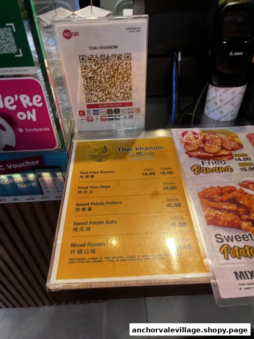 A close-up of Thai Khanom Bananas' menu displaying fried banana, yam, and sweet potato snacks.