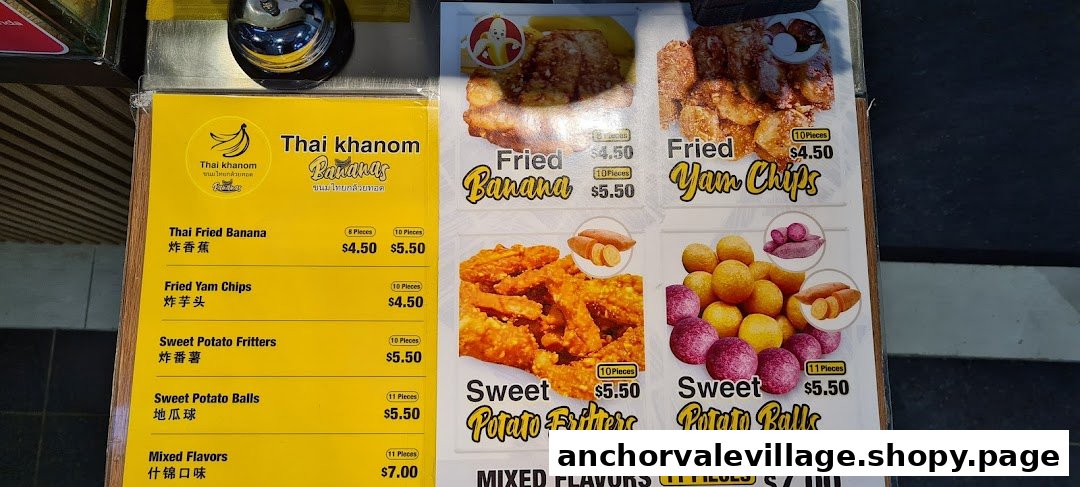 A vibrant menu board displaying prices and images of Thai fried banana and sweet potato snacks.