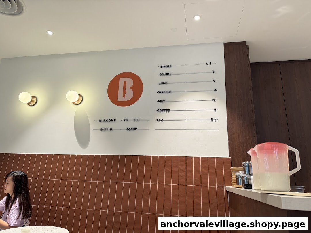 Interior shot of The Better Scoop featuring a menu board with ice cream and drink prices.
