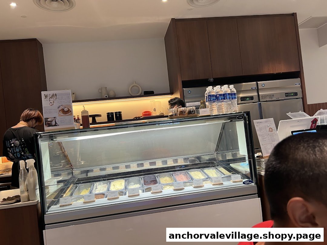 Interior view of The Better Scoop, featuring an ice cream display case and counter.