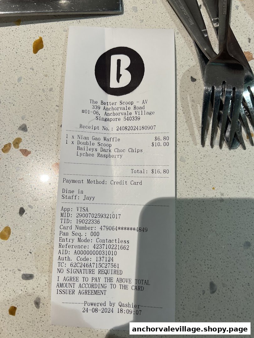 A close-up of a receipt from The Better Scoop showing purchased ice cream and waffle items.