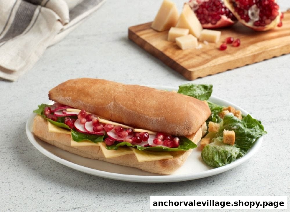 A vibrant sandwich with cheese, radish, and pomegranate, served with a side salad.