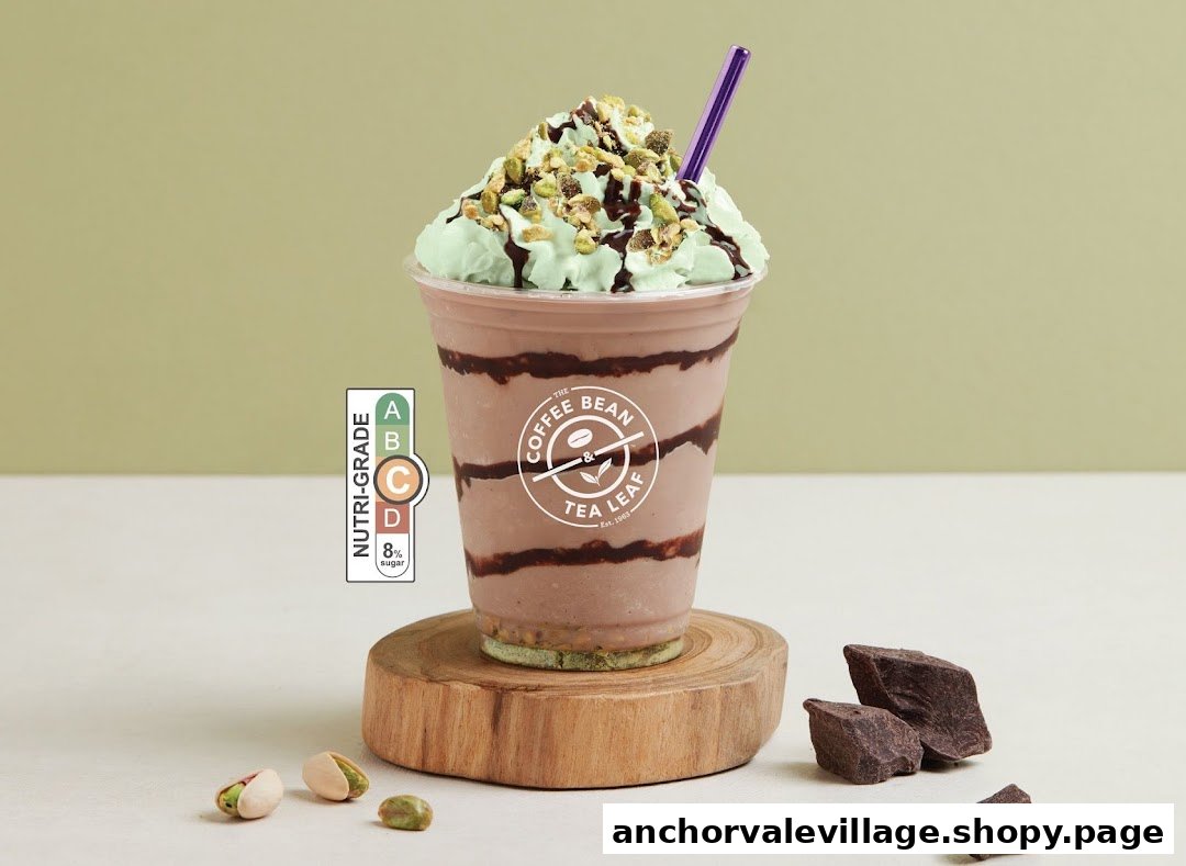 A chocolate and pistachio blended drink with whipped cream and nuts.