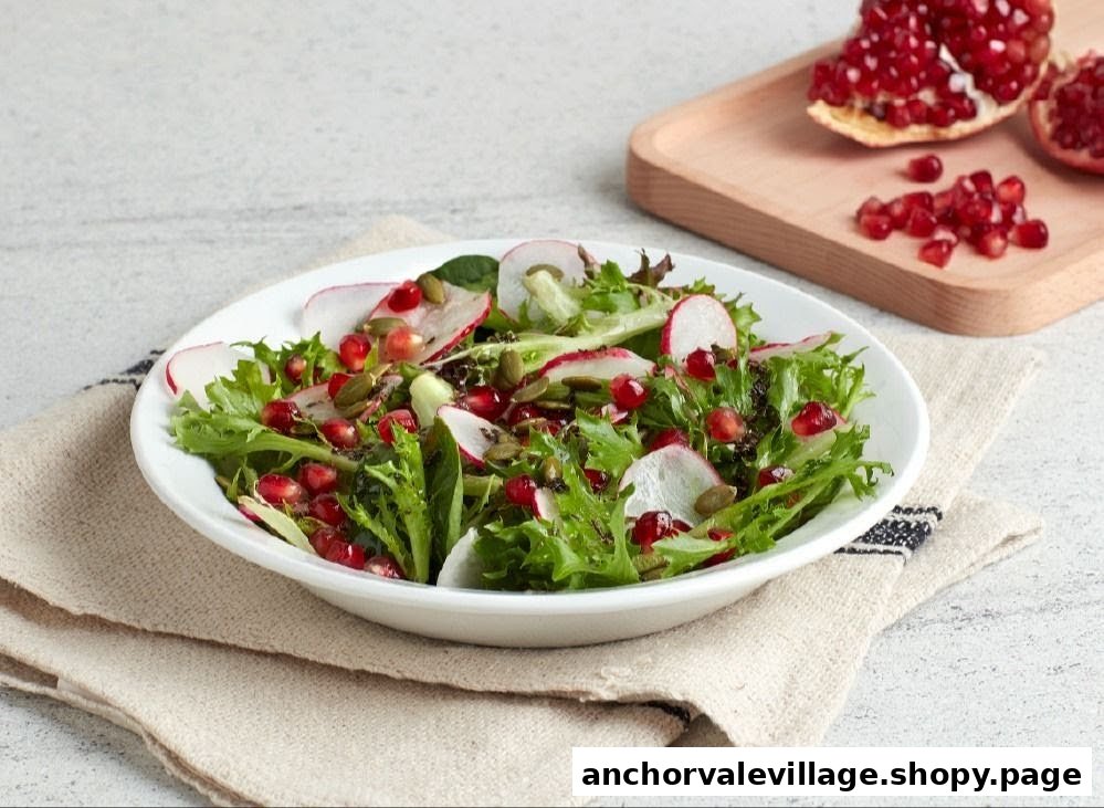 A vibrant salad bowl featuring mixed greens, sliced radishes, pomegranate seeds, and pumpkin seeds.