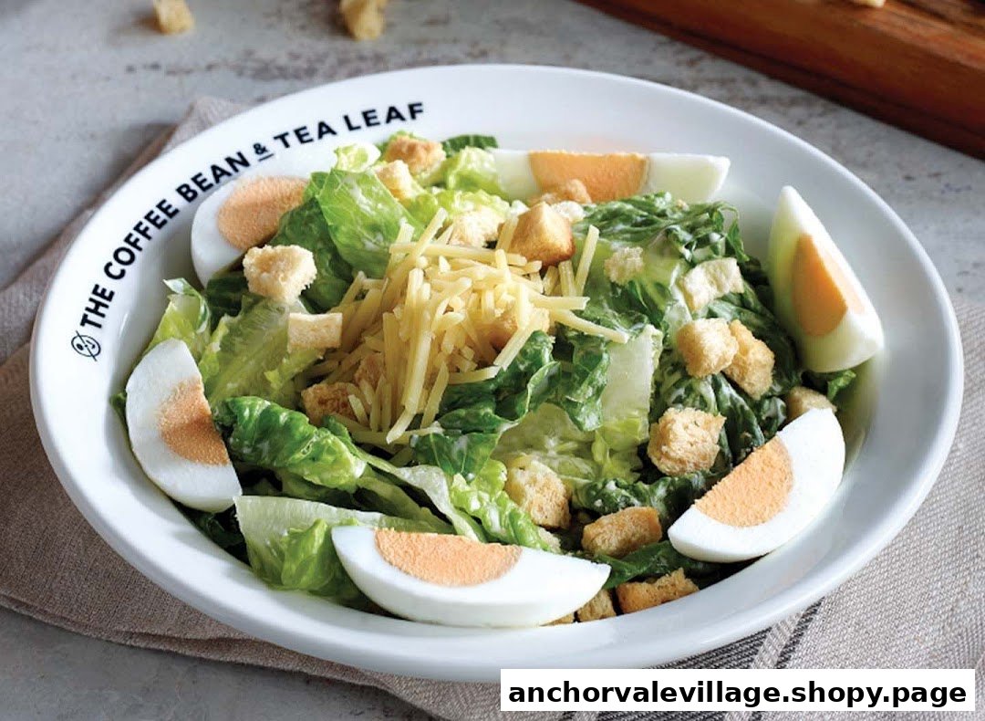 A fresh Caesar salad with lettuce, croutons, shredded cheese, and hard-boiled egg slices in a white bowl.