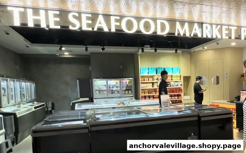 Interior of The Seafood Market Place, showcasing freezers, shelves, and staff.