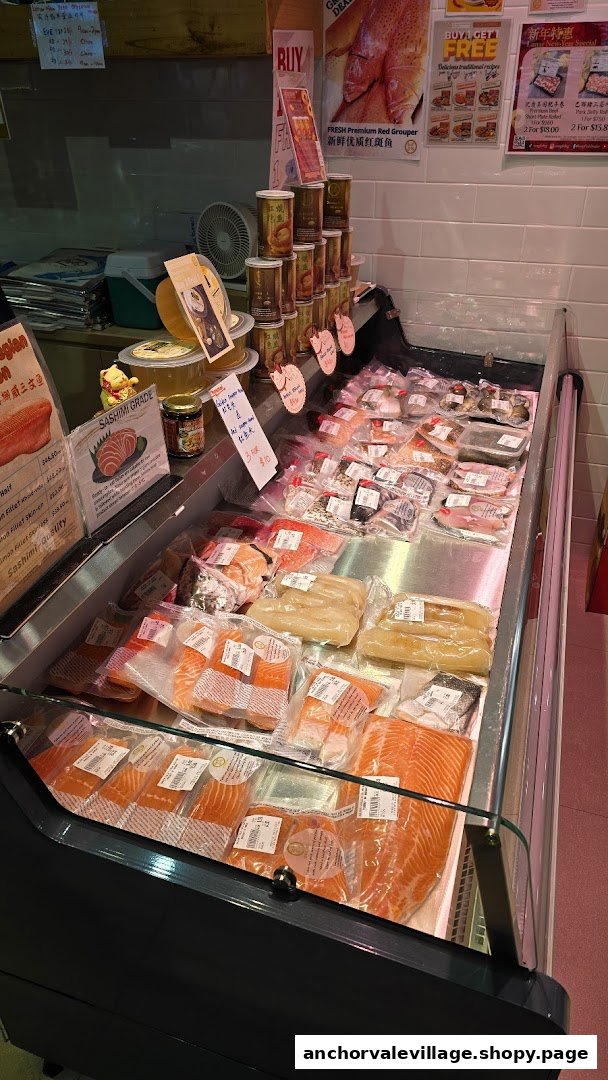 A refrigerated display case showcasing a variety of fresh, packaged seafood products.