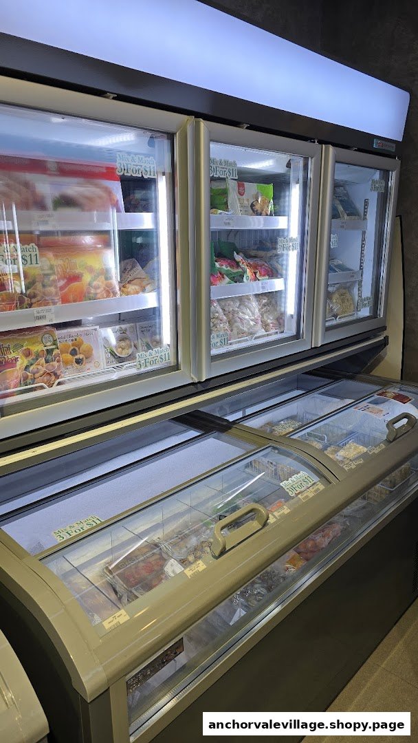 Brightly lit freezers display a variety of frozen seafood and food items with a 'Mix & Match' offer.