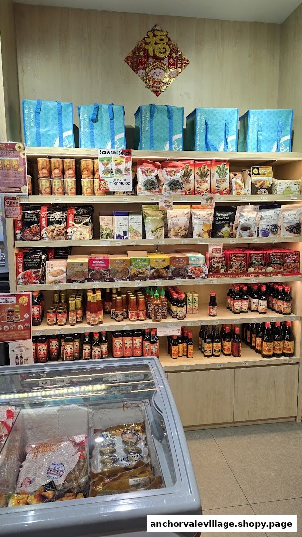 Shelves stocked with various Asian food products and a freezer display.