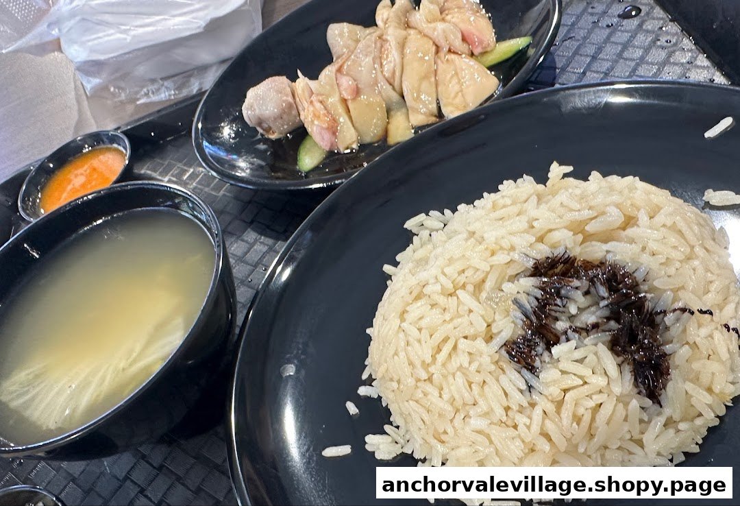 A delicious plate of chicken rice with soup and chili sauce from Uncle Louis.