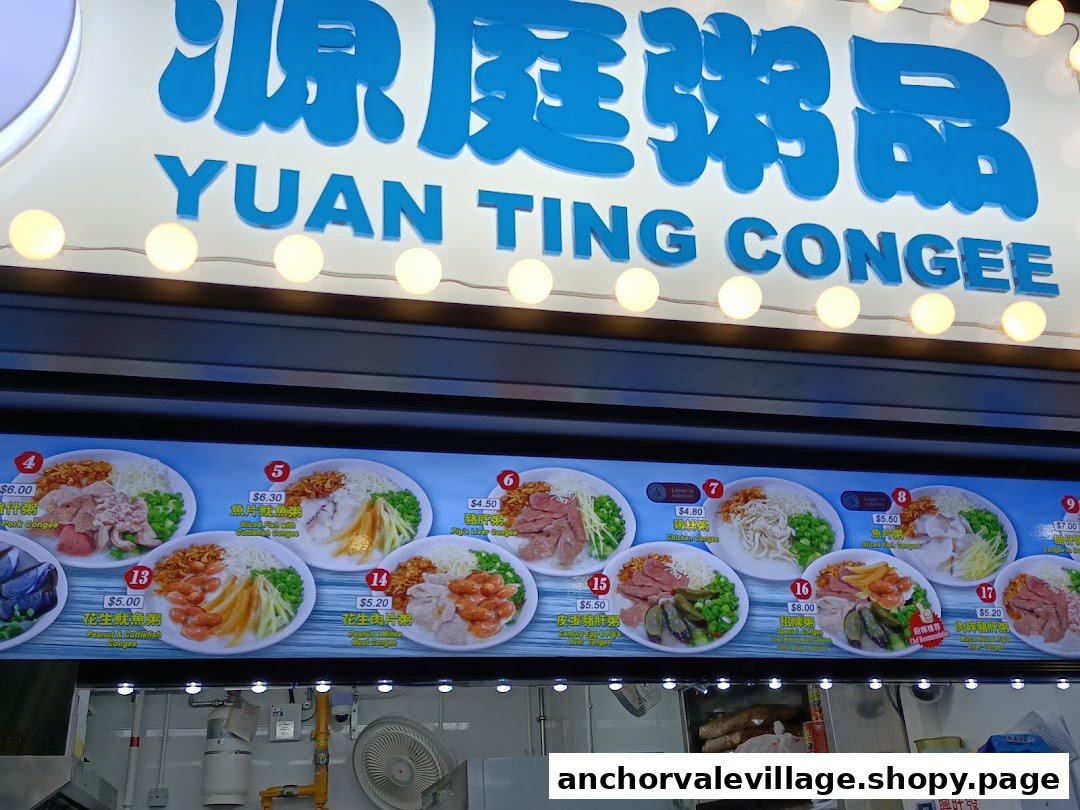 A brightly lit signboard for Yuan Ting Congee, featuring a visual menu display with various congee options and prices.