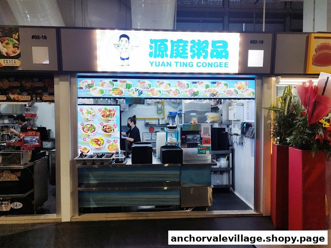 Exterior view of Yuan Ting Congee food stall with staff and vibrant menu displays.