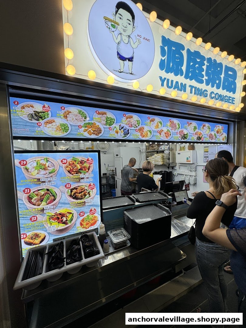The vibrant storefront of Yuan Ting Congee, showcasing its menu and a queue of customers.