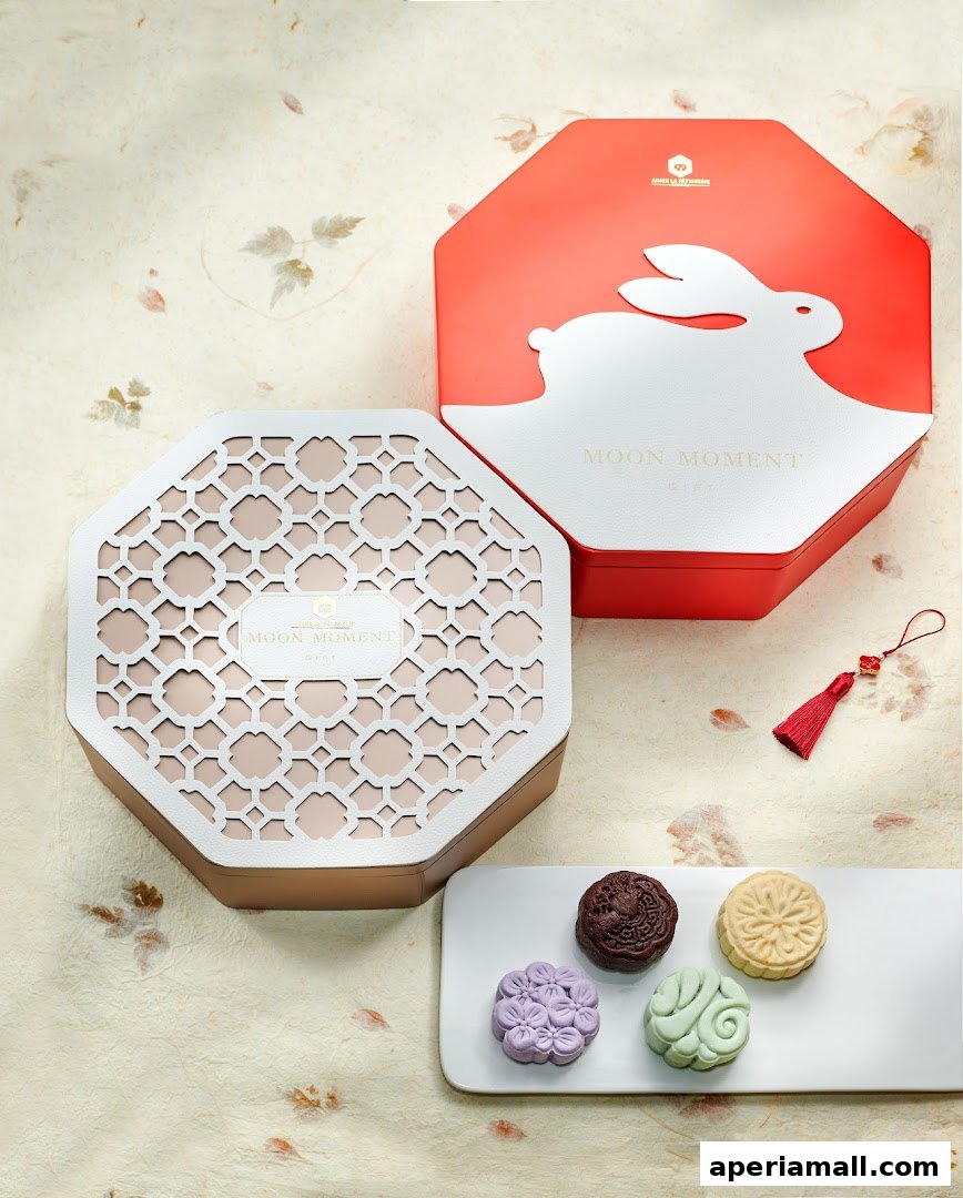 Beautifully presented mooncakes in elegant gift boxes with a decorative tassel.