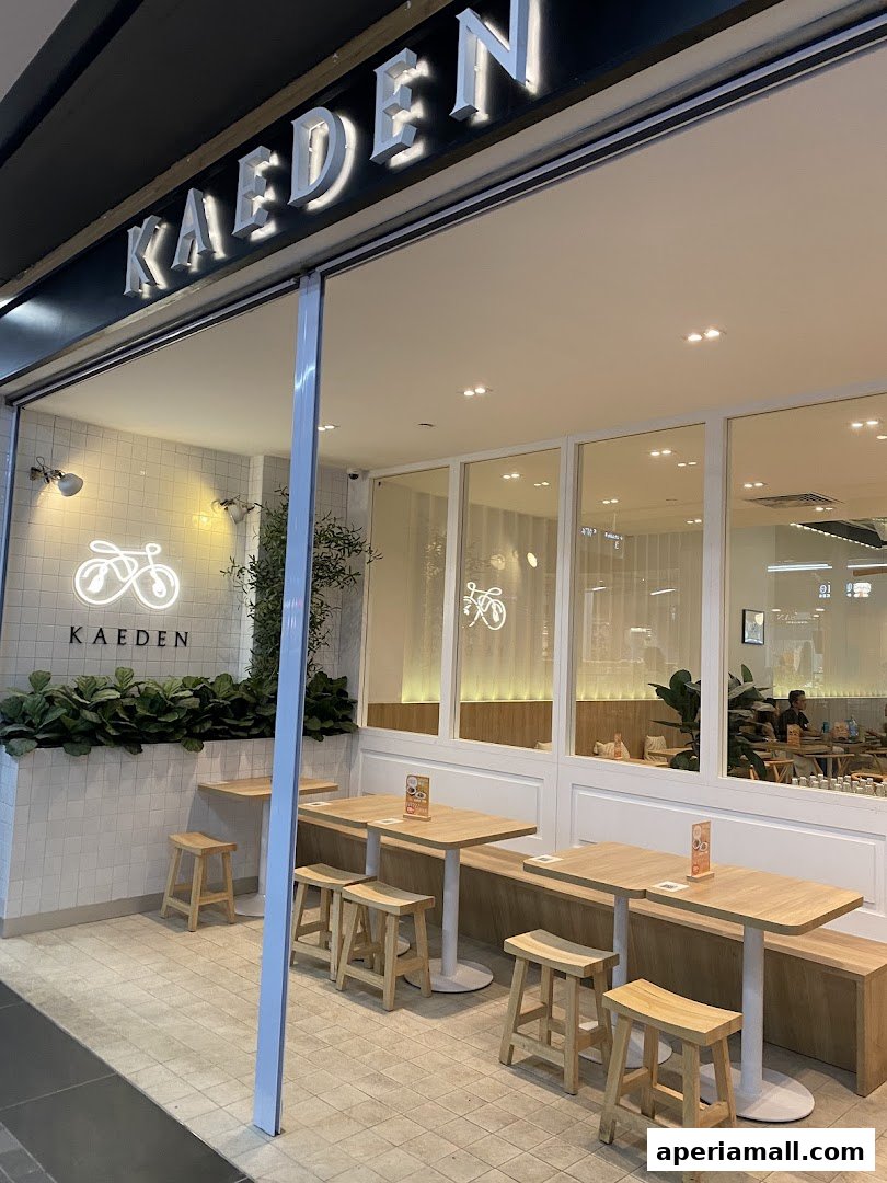 The exterior of the Kaeden shop with outdoor seating and a prominent sign.