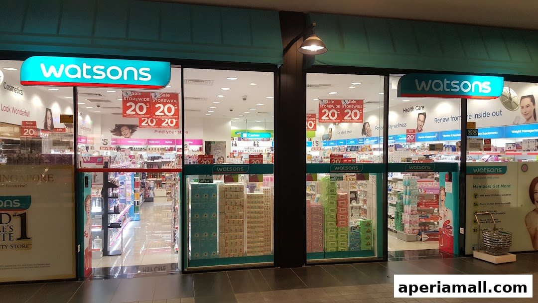 The entrance of a Watsons store with promotional signs and shelves stocked with products.