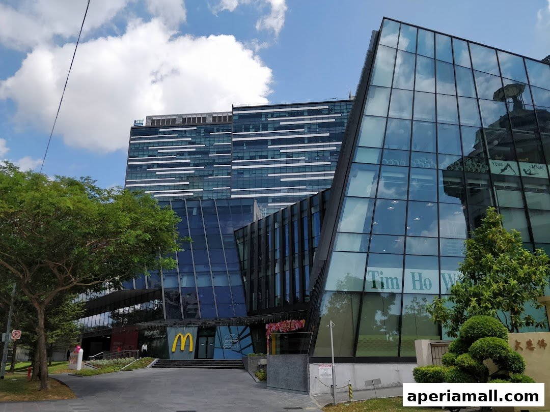 Modern glass-fronted buildings with McDonald's and Tim Ho Wan storefronts visible.