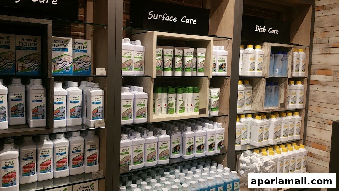 Shelves stocked with various Amway Home cleaning products, categorized by use.