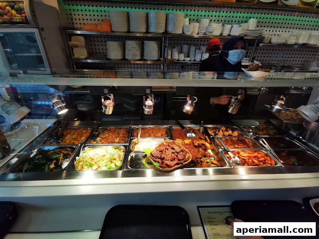 A display of various dishes in a food service counter at My Spice Affair.