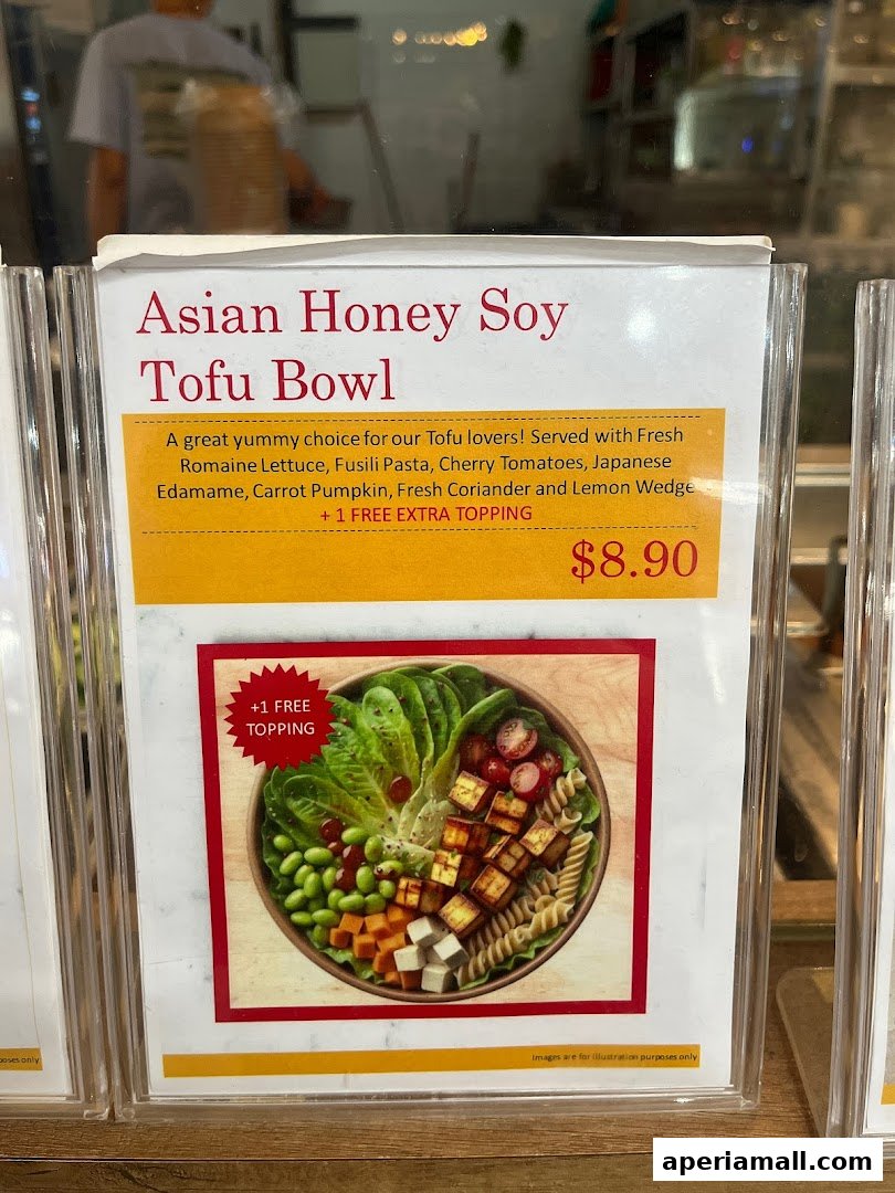 A menu item for Asian Honey Soy Tofu Bowl with ingredients and price.