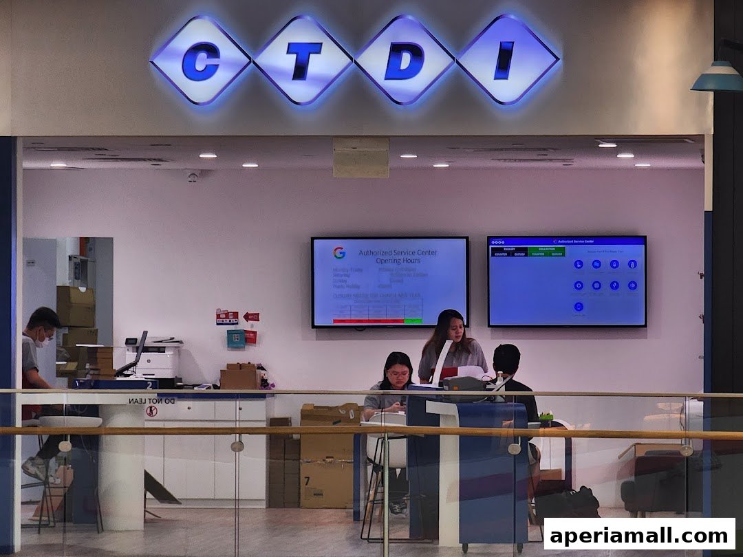 CTDI Singapore authorized service center with staff assisting customers and displaying service information.