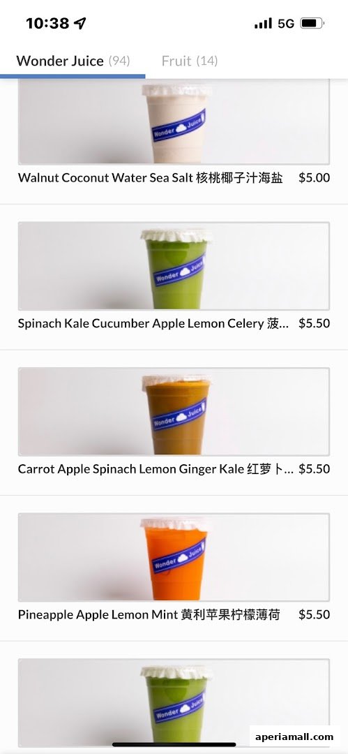 A menu display showing various juice options from Wonder Juice with prices.