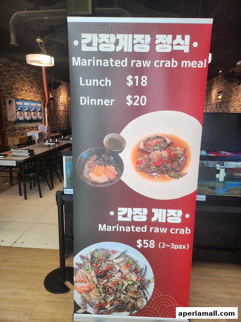 A promotional banner for marinated raw crab meals at a seafood restaurant.